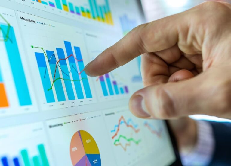 A person pointing at an analytics dashboard