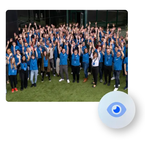 The Frisbii team poses for a group photo all have their hands in the air